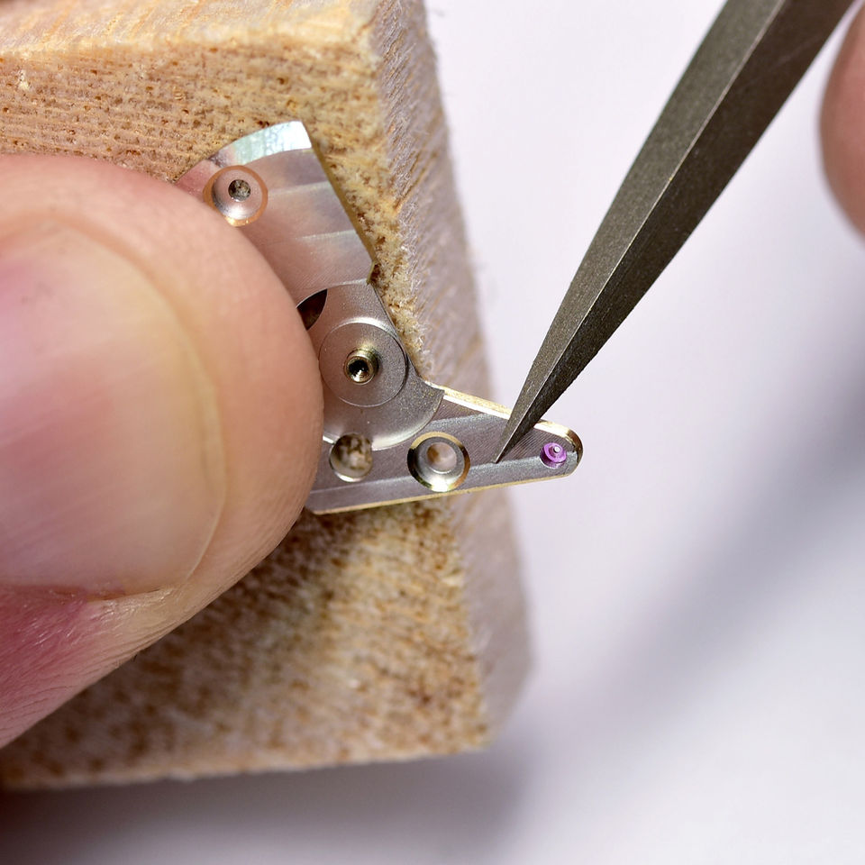 hand beveling of the watch movement parts
