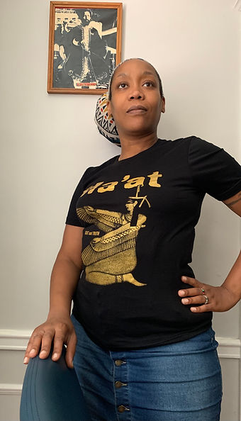 picture of blackwoman in a black t-shirt with theword and image of Goddess Maat