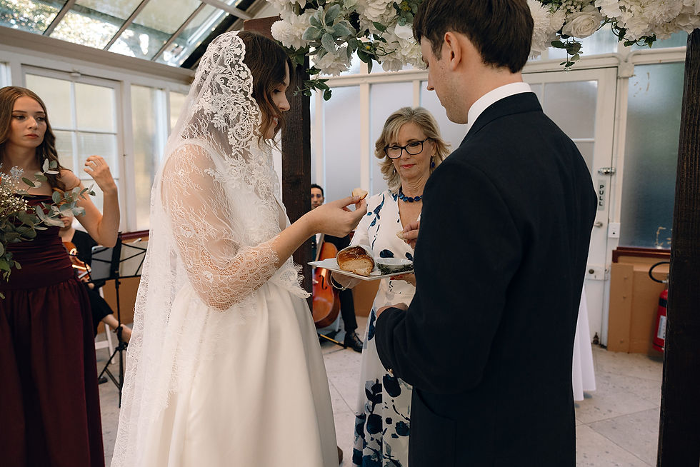Couple taking part in Jewish & Croatian rituals during their mult-cultural wedding ceremony in Sydney.