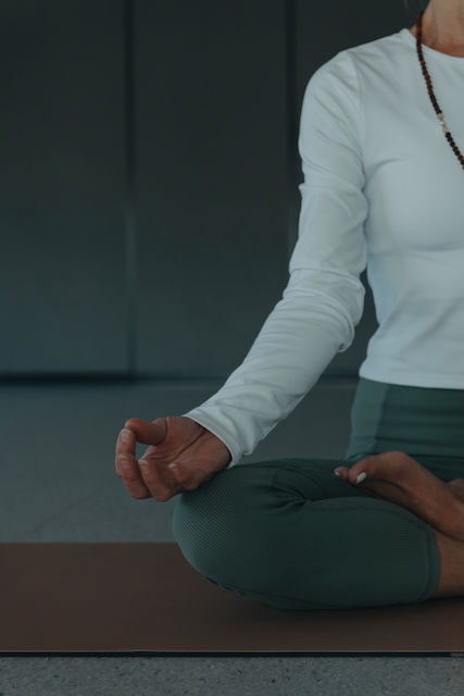 Lotta seated, guiding a Yoga Nidra class