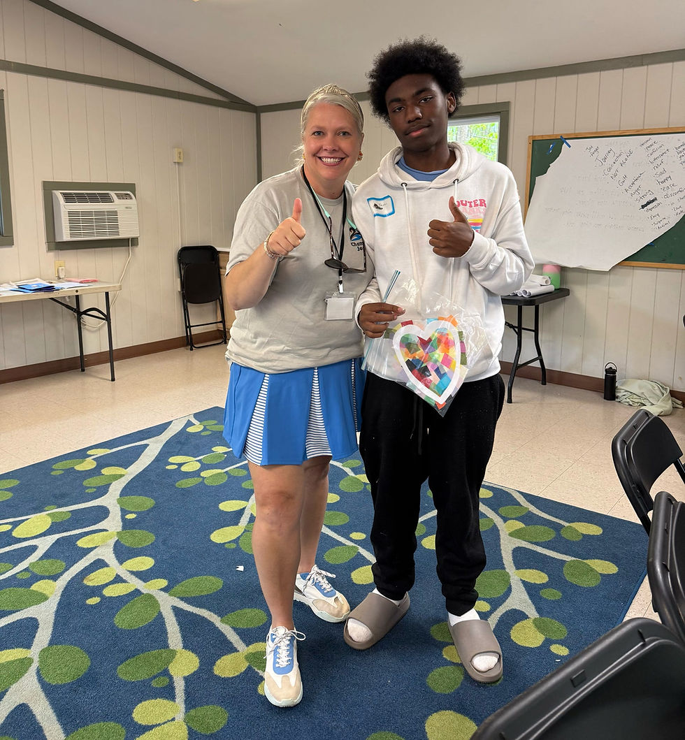 Brittany Luther with a Chameleon's Journey Camper.