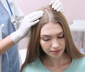 original_woman_getting_hair_examined.jpg