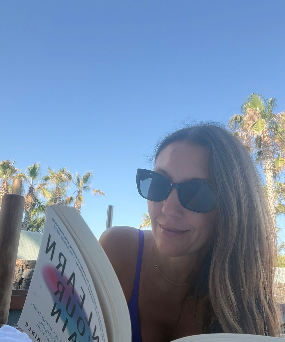 Rachel reading Unlearn Your Pain by Dr Howard Schubiner