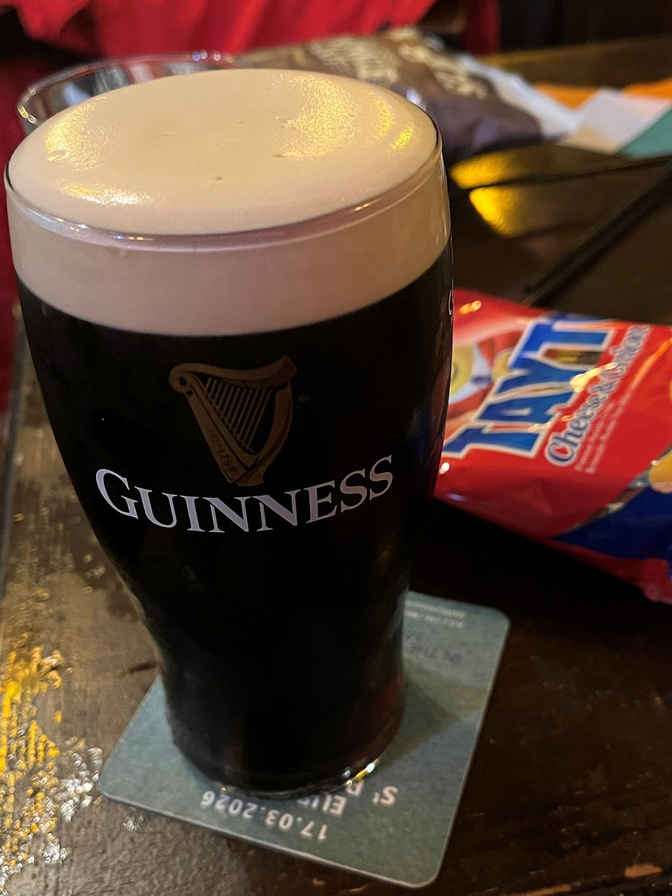 Green socks, purple hat, yellow notebook for St Patrick’s Day, celebrating in Leuven, Brussels and London 