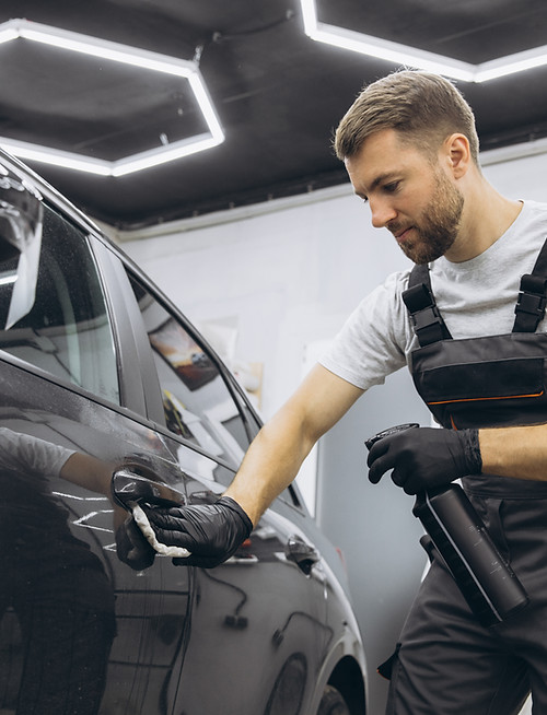 technician-gloves-applies-protective-film-cars-side-door-specialist-apply-liquid-preparati
