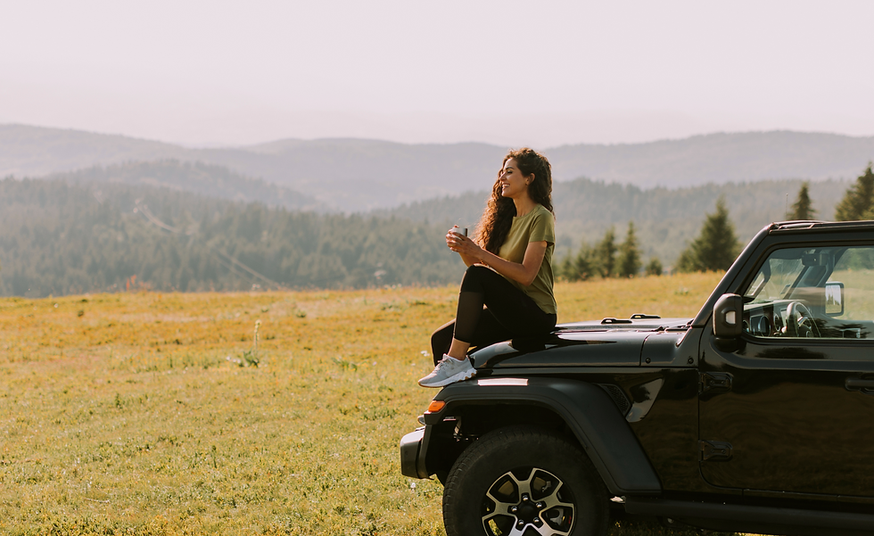 young-woman-relaxing-terrain-vehicle-hood-countryside_edited_edited_edited_edited_edited.p