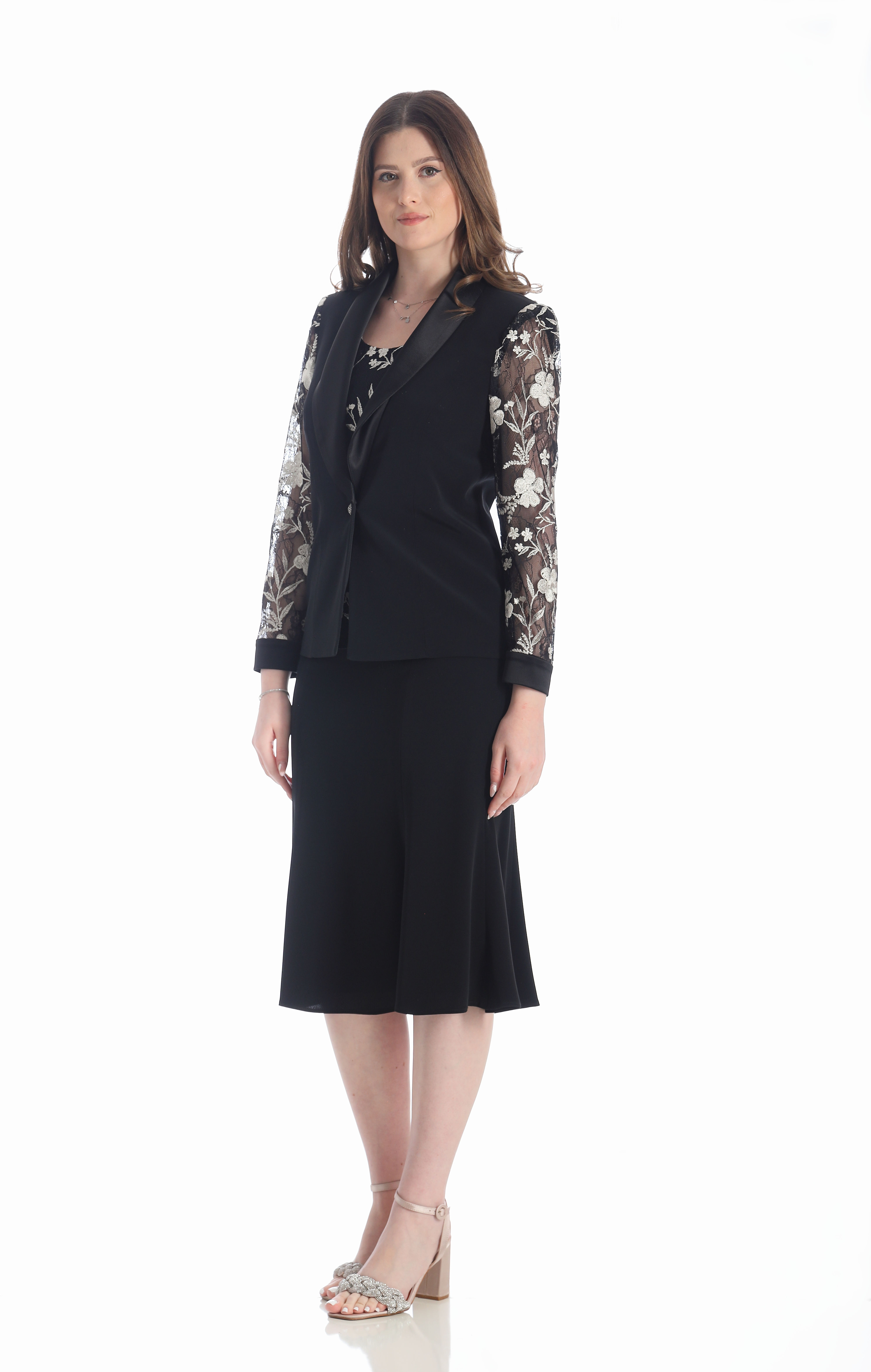 A high fashion model wearing a Lorellana Couture Mother of the Bride dress