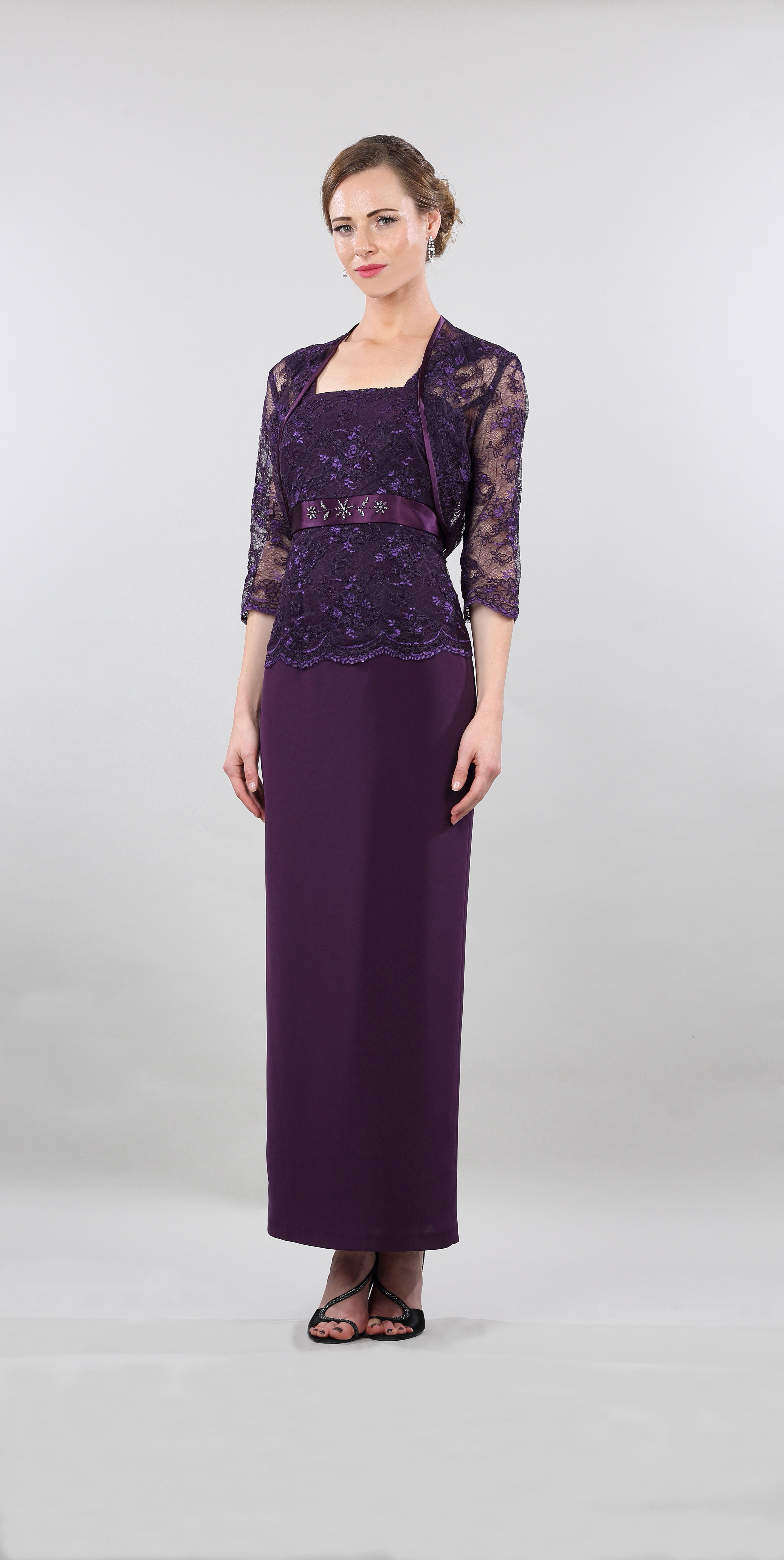 A high fashion model wearing a Lorellana Couture Mother of the Bride dress