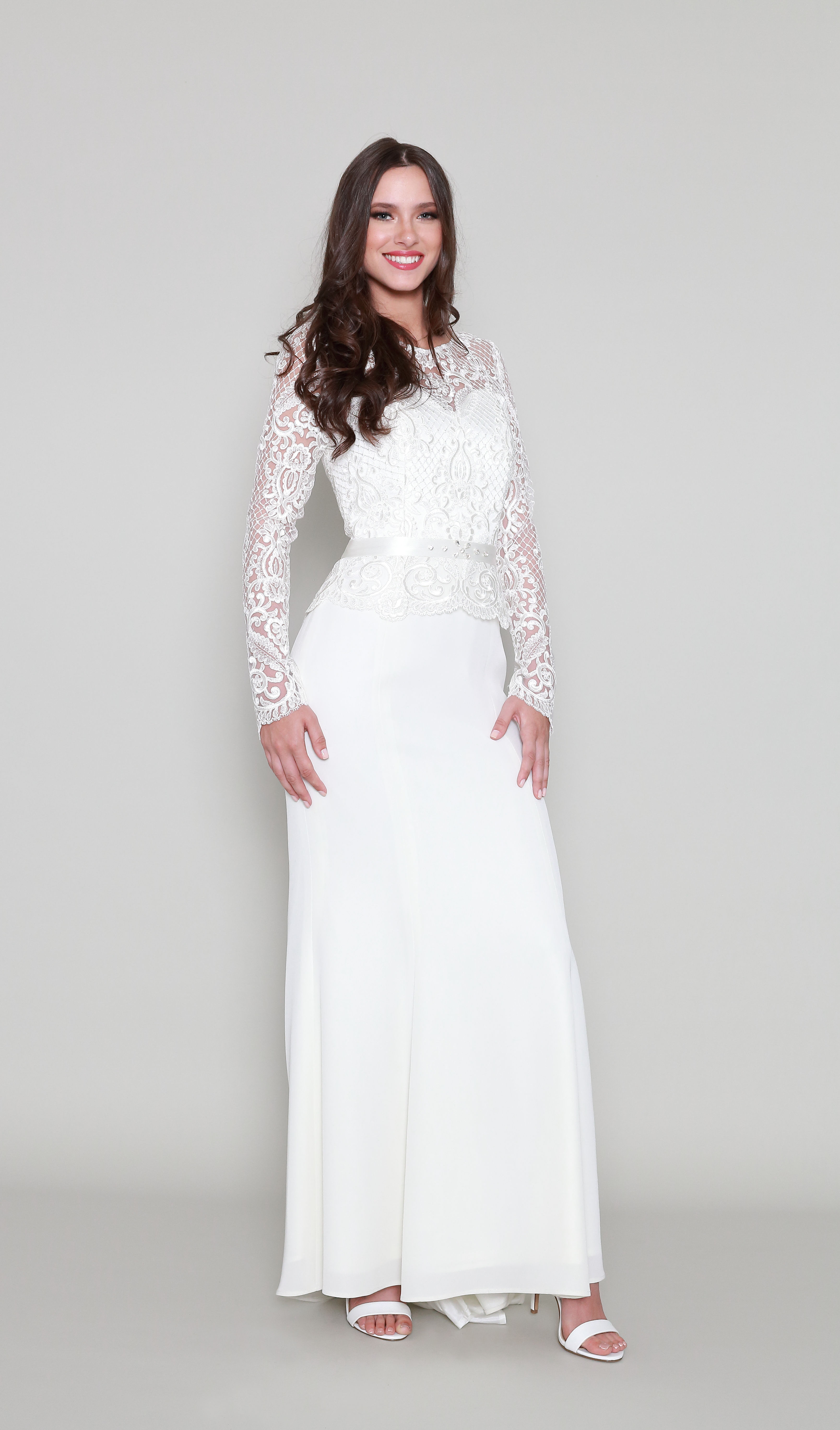 A high fashion model wearing a Lorellana Couture Mother of the Bride dress