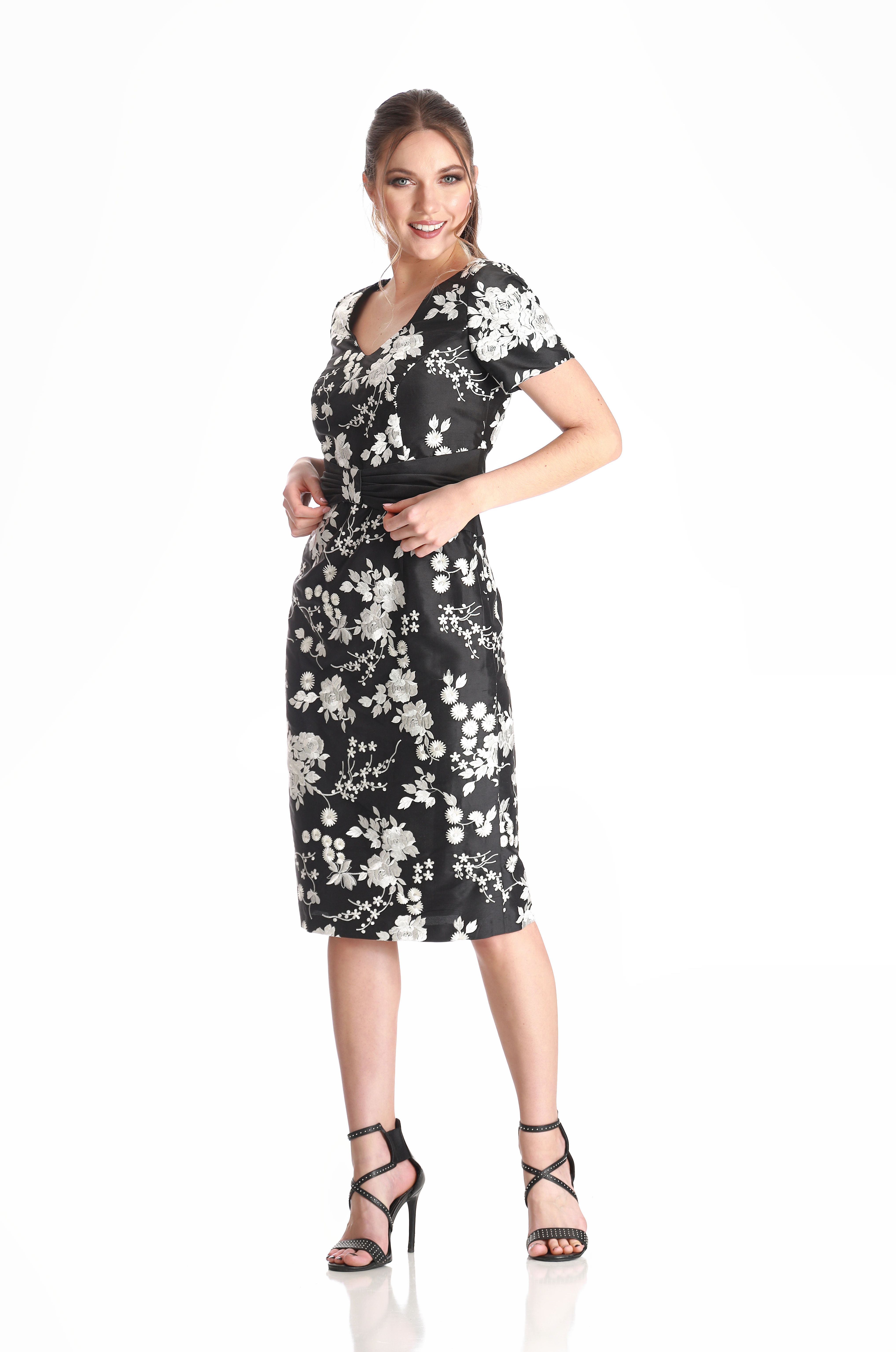 A high fashion model wearing a Lorellana Couture Mother of the Bride dress