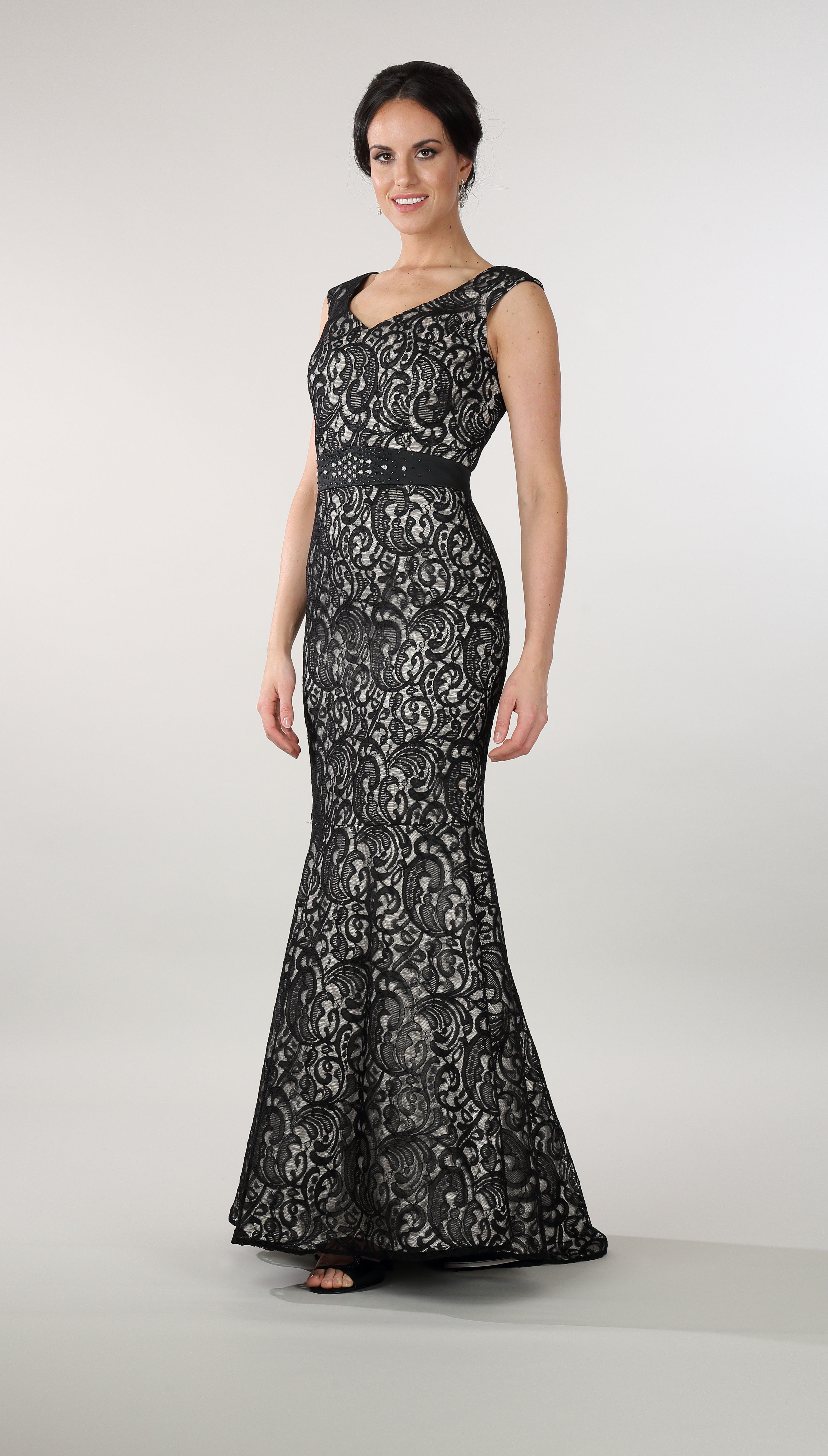 A high fashion model wearing a Lorellana Couture Mother of the Bride dress