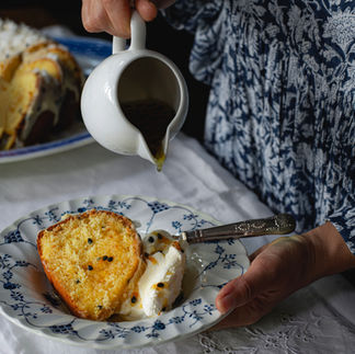 Glaze being poured on cut cake slice