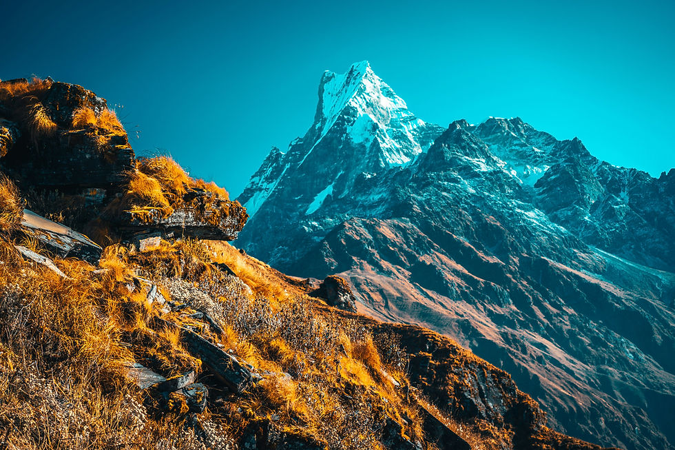Snow-capped peaks of the Mardi Himal trek, offering Himalayan depth for yoga journeys. Photo by Raimond Klavins on Unsplash