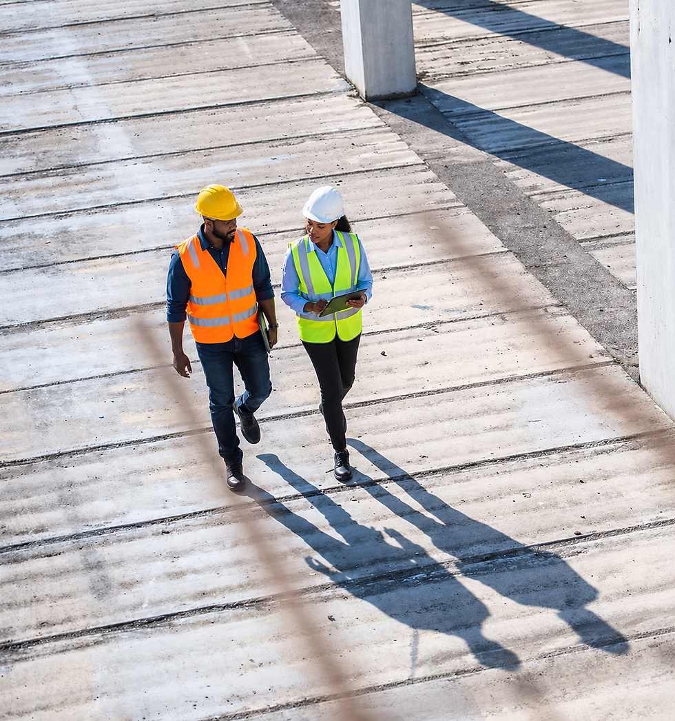 6_ Construction Professionals Reviewing Plans on Site.png