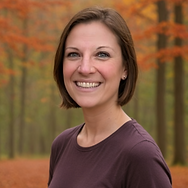 Headshot photo of Danae Crume. Warm autumn colors and trees with changing leaves.