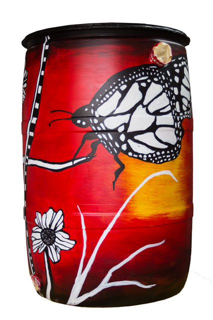 red rain barrel with butterfly and flower