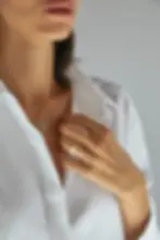 Thumbnail: Model wearing gold rings by Kelly Fletcher Jewelry