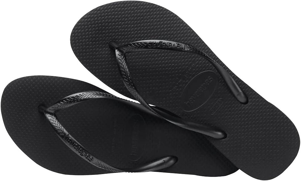 Pair of black flip-flops, travel essentials