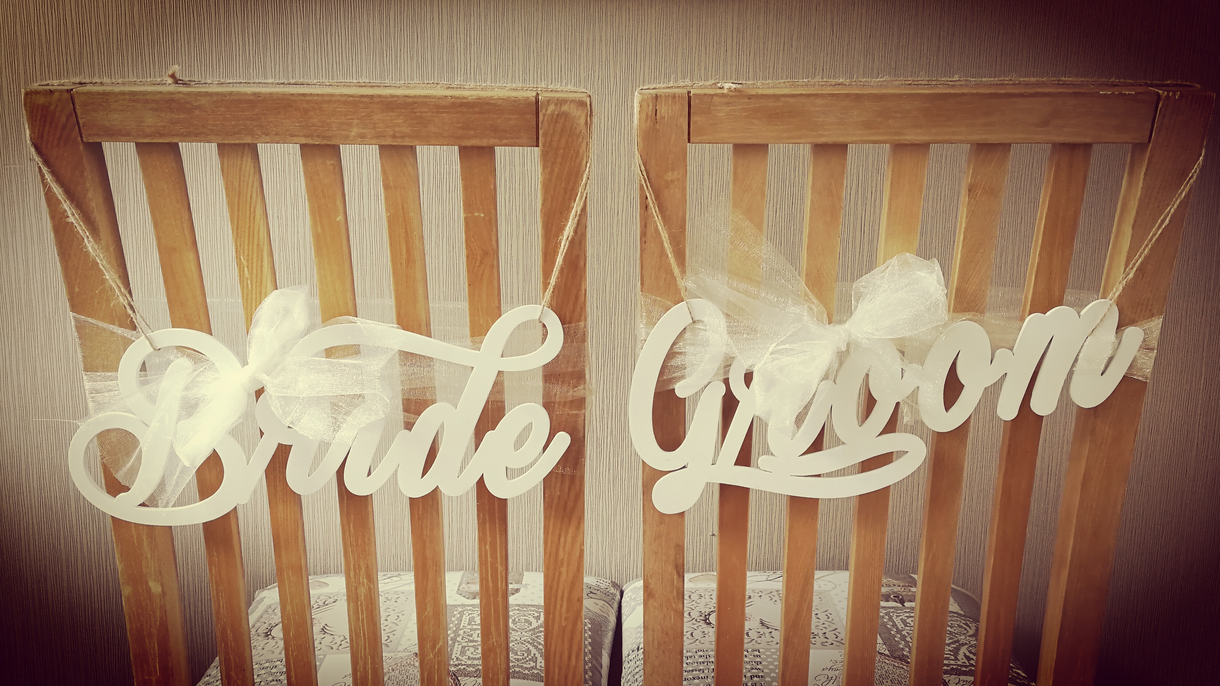 White wooden chair signs