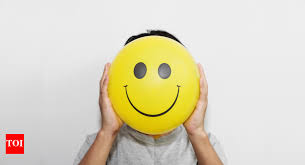 A person wearing a mask with a smiley face hides their true emotions, while behind the mask, they look visibly stressed and sad — symbolizing the burden of pretending to be happy all the time.