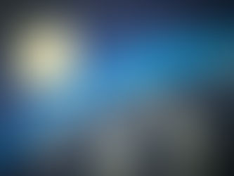Close-up of a blue credit card chip with embossed numbers 5523, in a soft-focus macro shot.