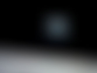 Earthrise over the Moon's horizon, showing Earth partially lit against the blackness of space. The Moon's surface is grey and textured.