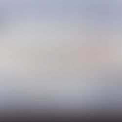 Torn paper with "End of YEAR" text on a computer keyboard background. "YEAR" is in red, conveying a theme of conclusion.