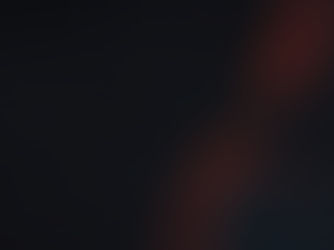 Red-hooded figure with hidden face in a dark, moody background, lit by dramatic red and blue shadows