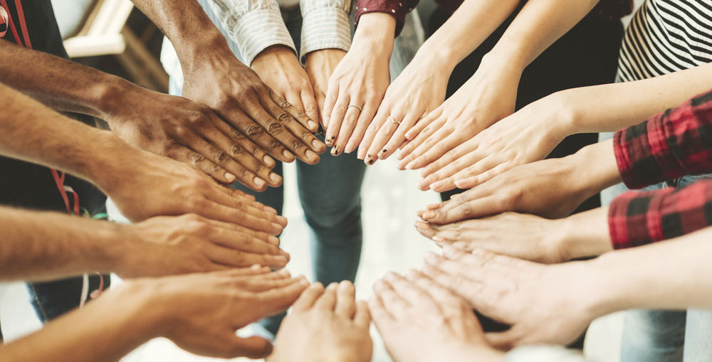 Mutual groups putting their hands in to help each others charities