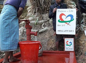 People using a new installed red water pump in Rohingya