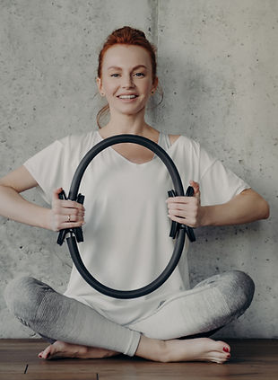 vecteezy_cheerful-fitness-woman-in-active-wear-sitting-in-lotus_7421244.jpg