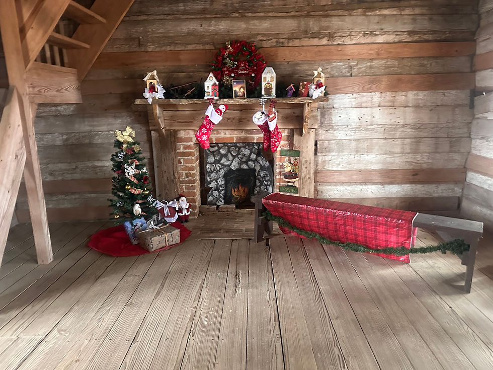 One of the rooms inside Rice Family Log Cabin is decorated for Christmas by the park staff.