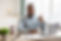 Happy Black Businessman At Laptop Gesturing Thumbs-Up Posing Smiling To Camera Sitting In