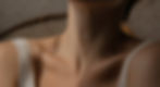 Close-up of a woman's neck and shoulders, implying a healthy thyroid