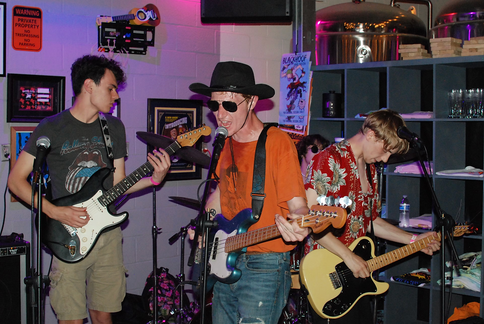 Alex Brannon (in the red Hawaiian shirt on the yellow guitar) closing night one of Hell Is Ohio in 2022 with his former band The Reedy Weeps