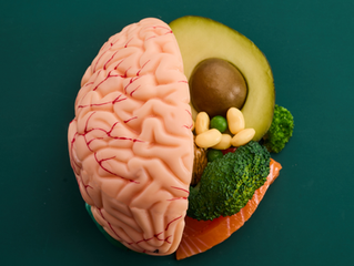 A brain split in half with the brain on the the left with various vegetables on the right.