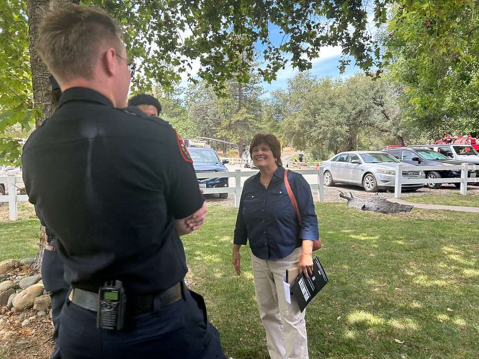 Candidate for El Dorado County Supervisor District 4, Gina Posey talks with Mosquito Firefighters at the "Shared Plates & Services Fire Station Potluck" prior to the July 1st MFPD Special Meeting.