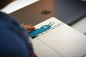 person holding blue and white car drawing_edited.jpg