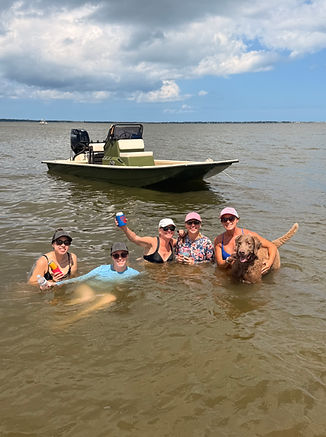 friends swimming in the water on an island hopping adventure