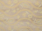 Paisley Dreams in Lavender chenille upholstery fabric with a light purple background and delicate yellow floral accents.