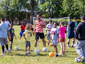 Diverse soccer community gathering at a grassroots football festival in the US