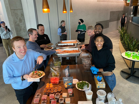 StartingBlock members getting food at buffet for the Wednesday FEED Kitchens Community Lunch event.