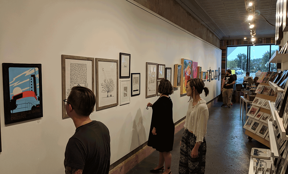 People looking at art in DNA Galleries art gallery store
