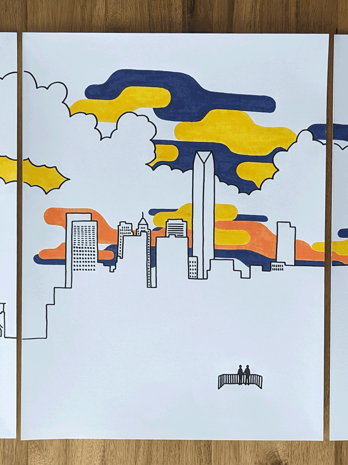 Two people on balcony looking at OKC skyline