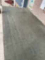Stamped concrete patio finished with a wood-plank texture, combining the appearance of natural wood