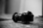 A Black and white image of a DSLR camera