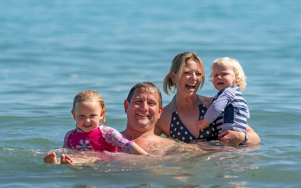Tom Gregory takes his wife and daughters swimming