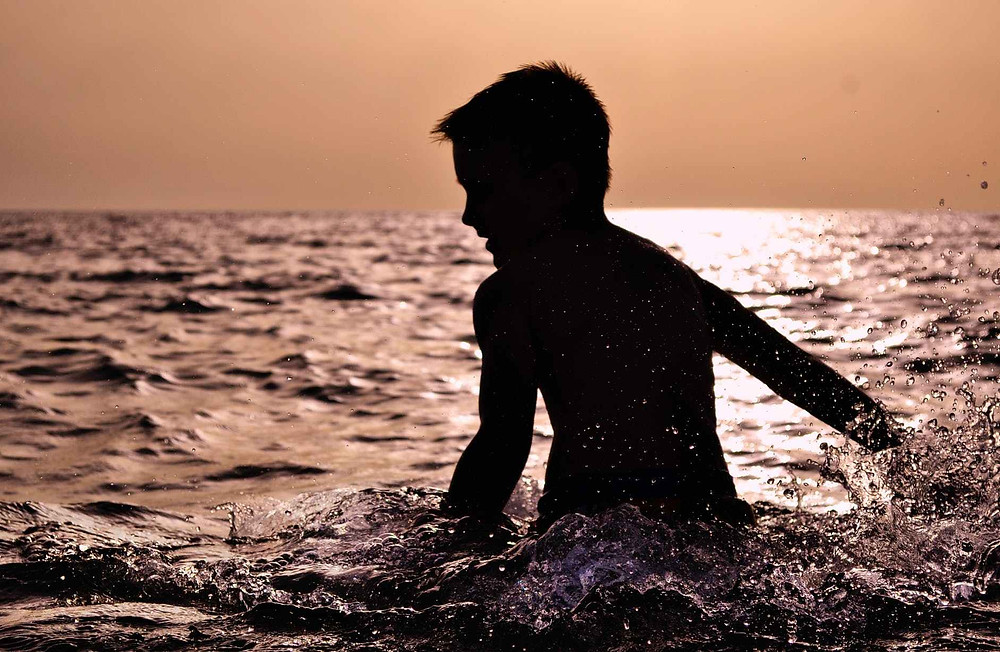 New Zealand children learning water survival skills