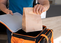 man-preparing-takeaway-food-delivery.jpg