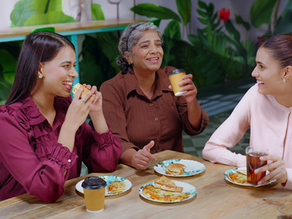 A group of colleagues enjoying a meal at a foodcourt